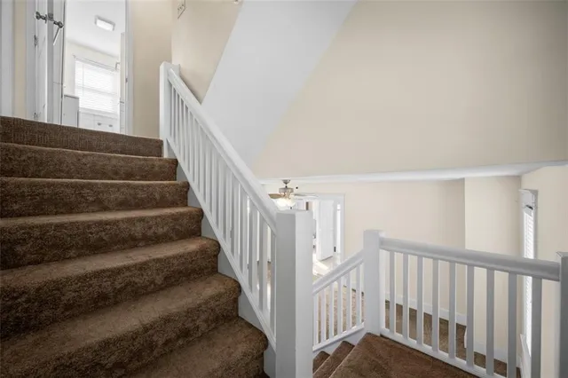 a view of empty room with ceiling fan