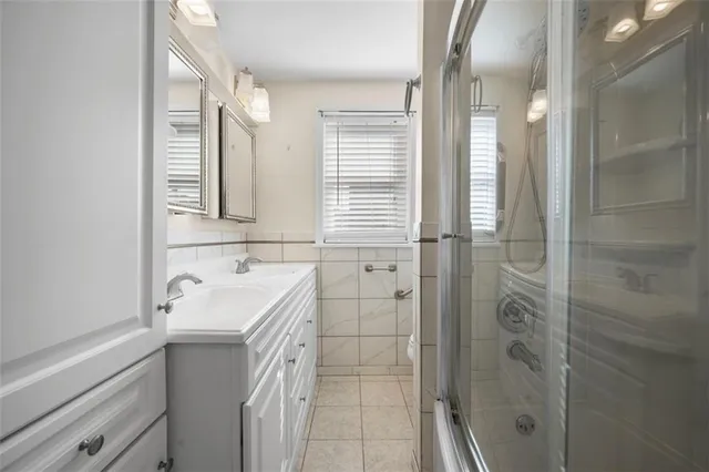 an empty room with fan and windows