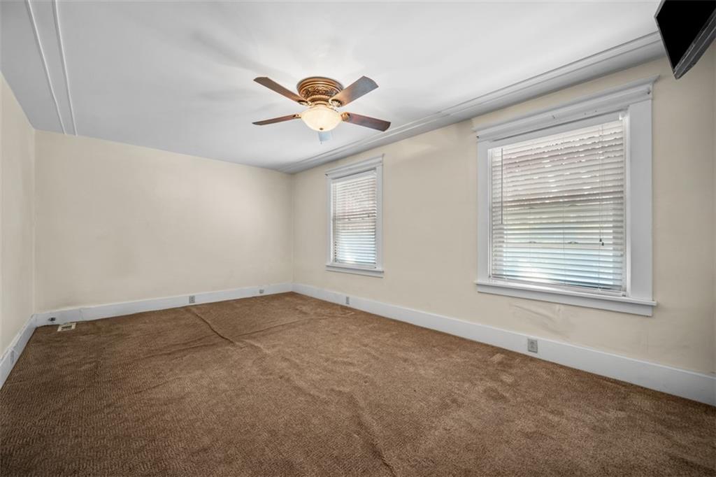 254 Ridge Avenue New Kensington, PA 15068 - Photo 25 of 50 an empty room with a window and a fan