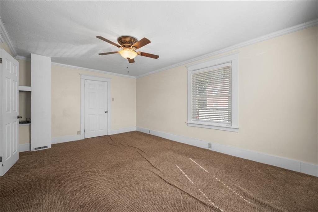 254 Ridge Avenue New Kensington, PA 15068 - Photo 26 of 50 a view of a room with a ceiling fan and a window