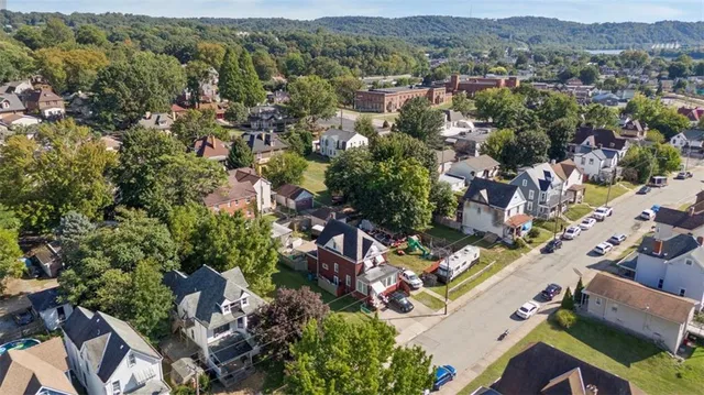 an aerial view of residential houses with outdoor space