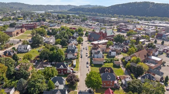 an aerial view of residential houses and outdoor space