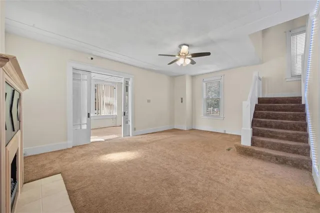 a view of an empty room with a fireplace