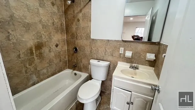 a bathroom with a sink and toilet