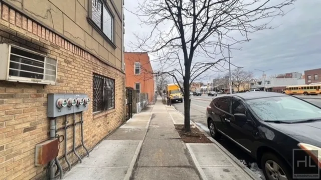 a view of a city street with cars