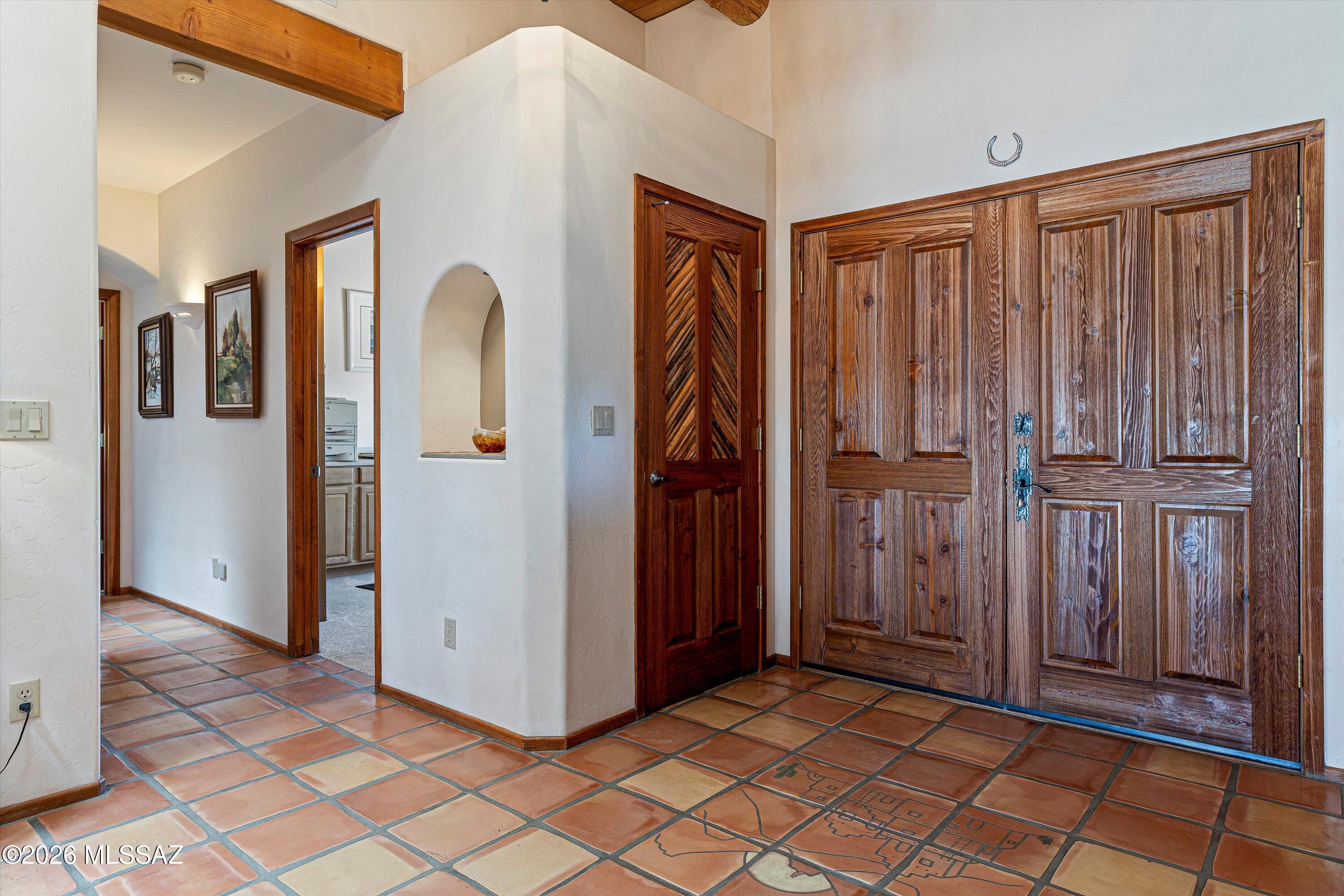 11160 East Golf Links Road Tucson, AZ 85730 - Photo 6 of 51 Down the hallway behind the coat closet you’ll find two bedrooms and a full bath.