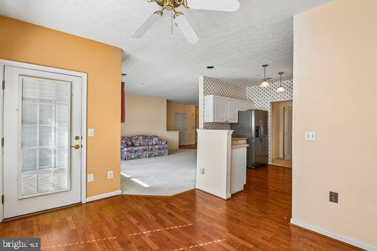 9511 Kingscroft Terrace, Unit 9511F Perry Hall, MD 21128 - Photo 23 of 38 a view of a kitchen cabinets and wooden floor