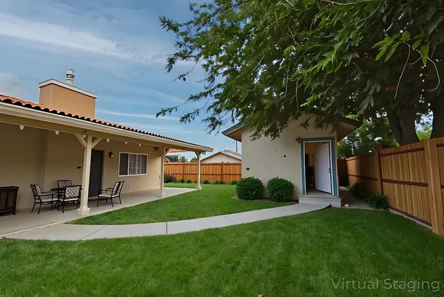 a front view of a house with a yard and trees