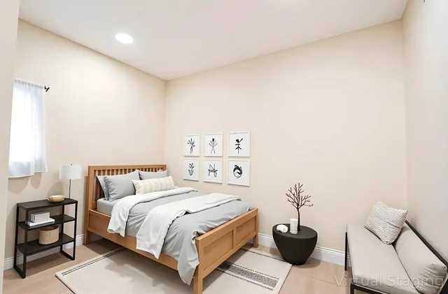 a bedroom with a bed and a couch