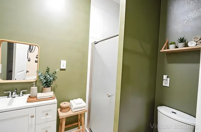 a bathroom with a sink mirror and toilet
