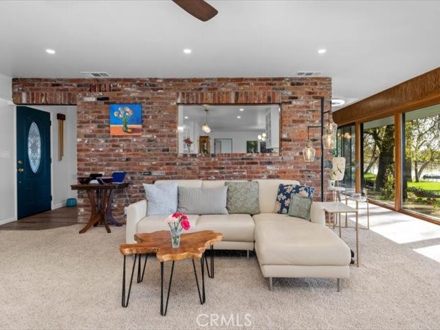 195 Howell Avenue Red Bluff, CA 96080 - Photo 22 of 67 a living room with furniture and a large window