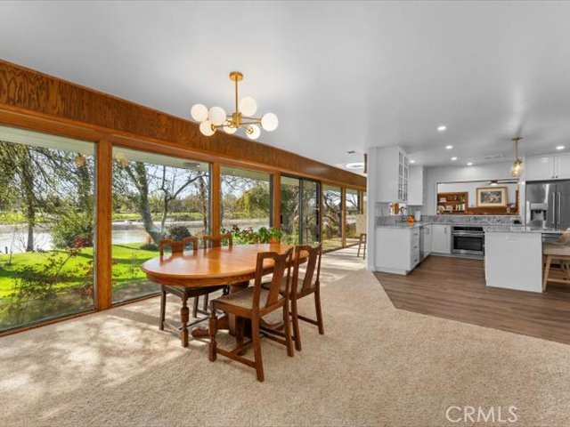 195 Howell Avenue Red Bluff, CA 96080 - Photo 23 of 67 a dining room with furniture and a floor to ceiling window
