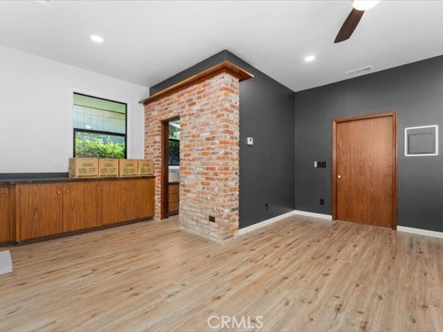 195 Howell Avenue Red Bluff, CA 96080 - Photo 31 of 67 a view of an empty room with wooden floor and a window
