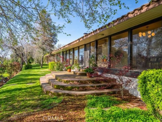 195 Howell Avenue Red Bluff, CA 96080 - Photo 42 of 67 a front view of a house with a yard table and chairs