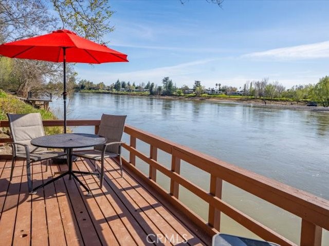 195 Howell Avenue Red Bluff, CA 96080 - Photo 52 of 67 a view of a rooftop deck with couch and an umbrella