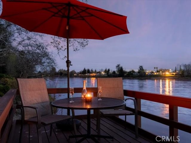 195 Howell Avenue Red Bluff, CA 96080 - Photo 9 of 67 a view of a lake from a roof deck with seating space