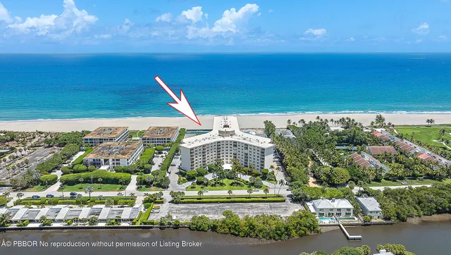 a balcony with table and chairs