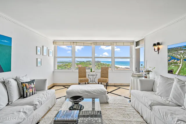 a kitchen with stainless steel appliances granite countertop a refrigerator a stove and a sink with wooden floor