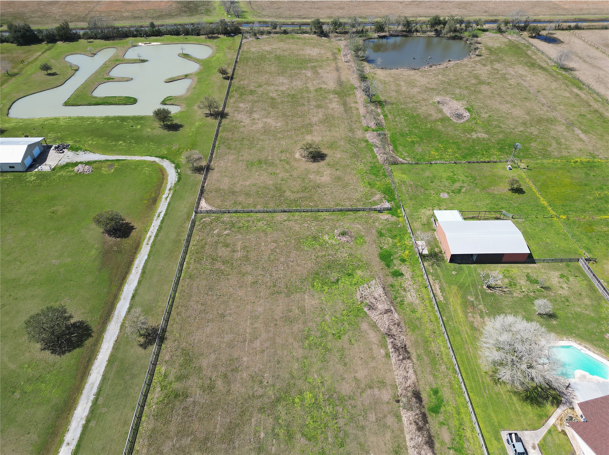 3080 South Pine Island Road Beaumont, TX 77713 - Photo 5 of 7 an aerial view of a house with a lake view