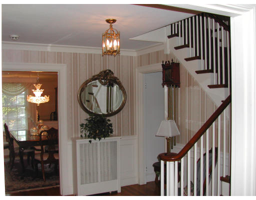 5 Marvin Road Wellesley, MA 02482 - Photo 2 of 6 a view of a hallway with entryway wooden floor and front door