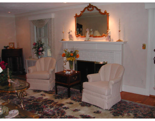 5 Marvin Road Wellesley, MA 02482 - Photo 3 of 6 a living room with furniture and a fireplace