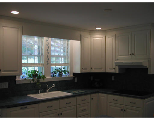 5 Marvin Road Wellesley, MA 02482 - Photo 5 of 6 a kitchen with granite countertop a sink and a white cabinets
