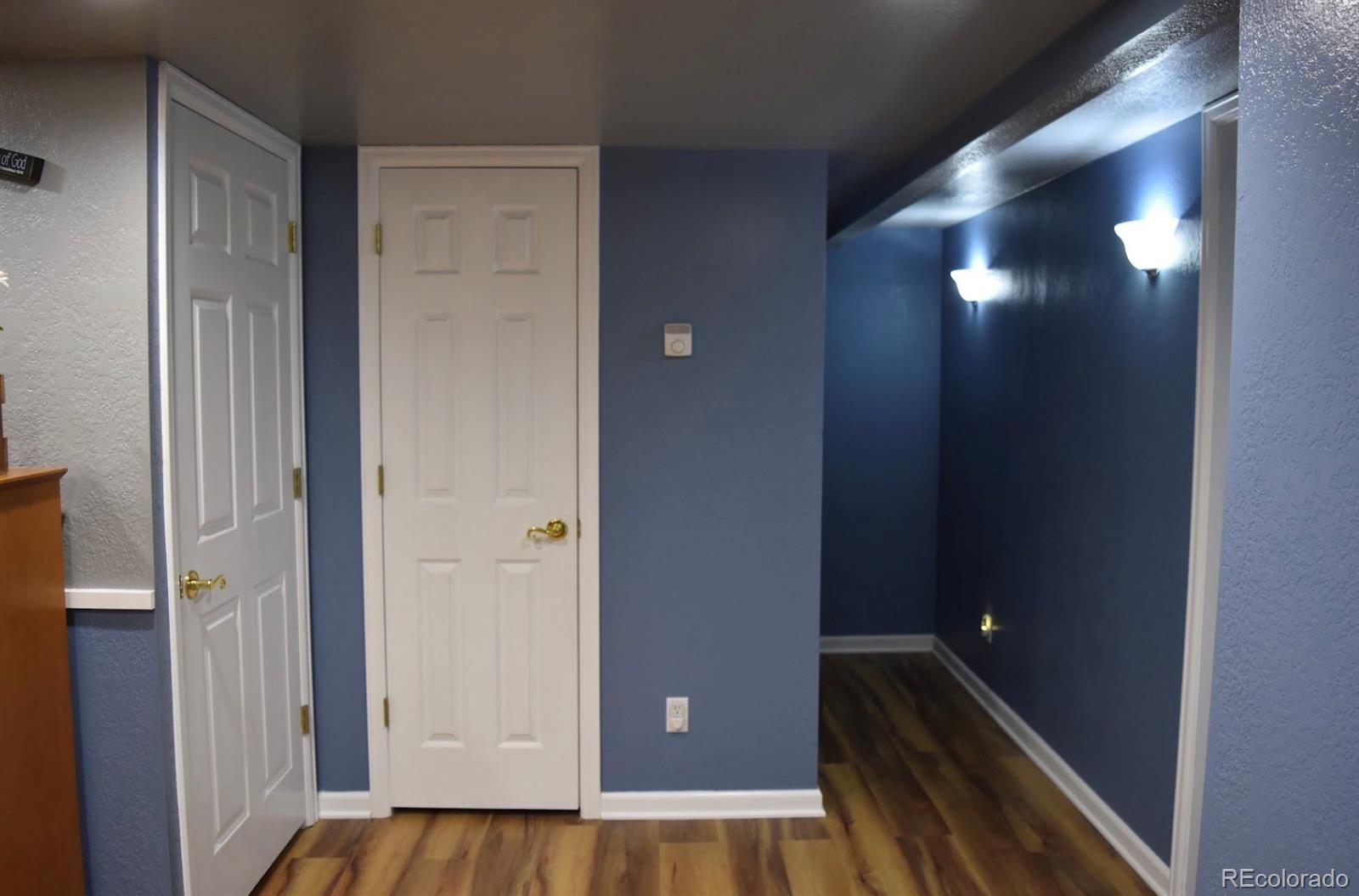 1426 3rd Street Fort Lupton, CO 80621 - Photo 26 of 50 a view of empty room with wooden floor