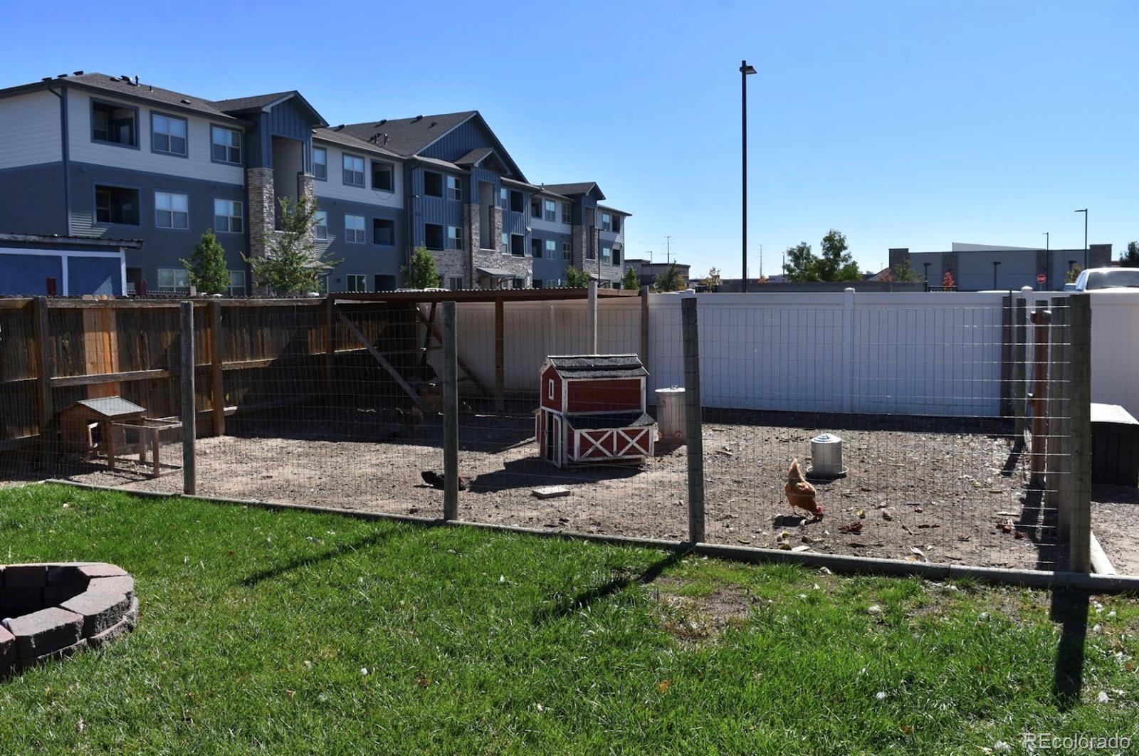 1426 3rd Street Fort Lupton, CO 80621 - Photo 38 of 50 a view of a chairs and table in backyard