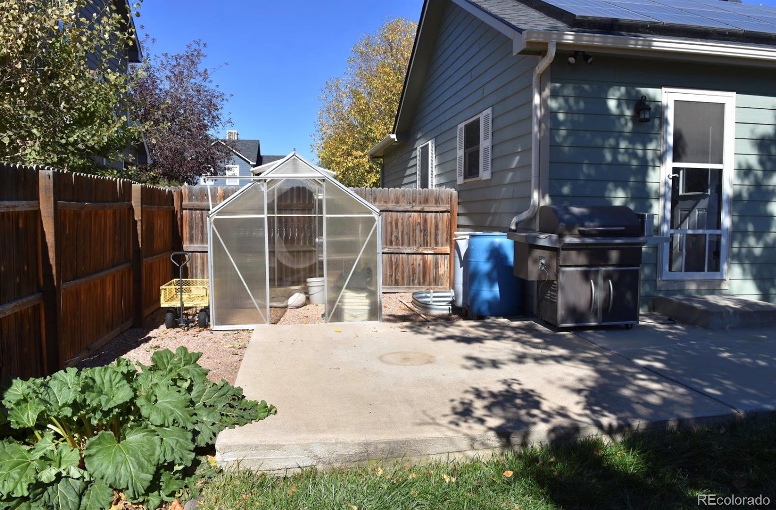 1426 3rd Street Fort Lupton, CO 80621 - Photo 40 of 50 a view of a house with a yard
