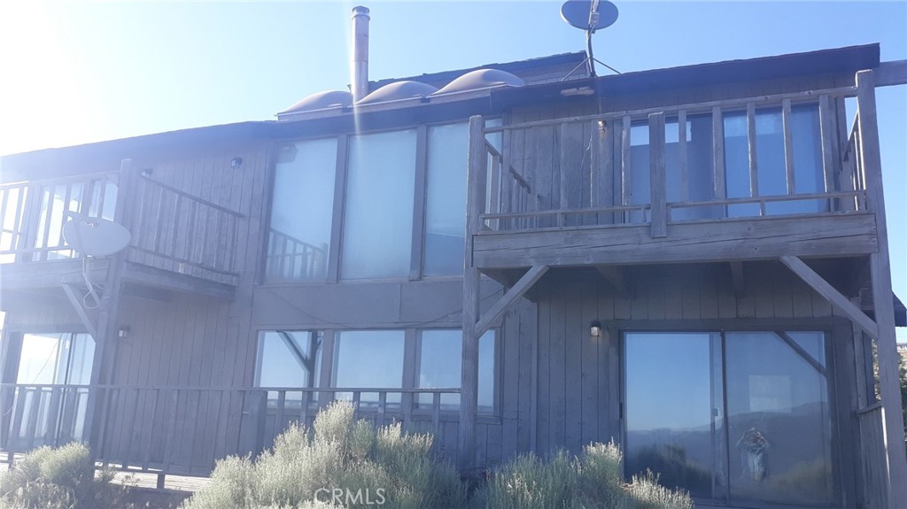 23441 El Rancho Drive Tehachapi, CA 93561 - Photo 12 of 30 a kitchen with a sink cabinets and chandelier