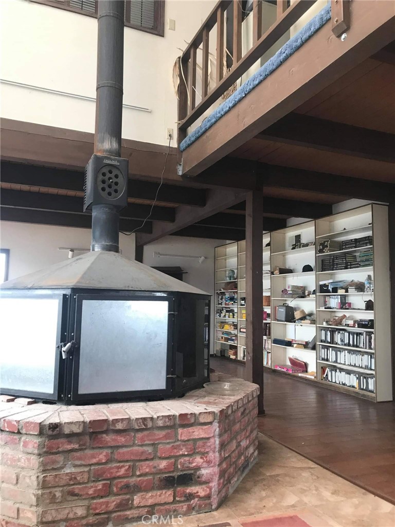 23441 El Rancho Drive Tehachapi, CA 93561 - Photo 18 of 30 a view of a living room with fireplace