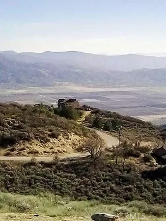 a kitchen with granite countertop a stove and a refrigerator