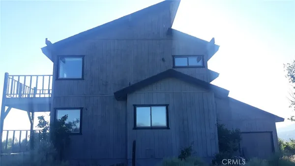 a white toilet sitting next to a small sink