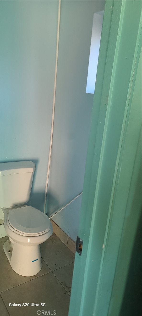 23441 El Rancho Drive Tehachapi, CA 93561 - Photo 22 of 30 a white toilet sitting next to a small sink