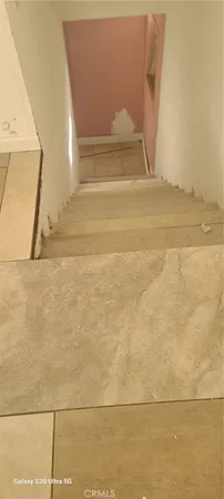 a bathroom with a shower and window