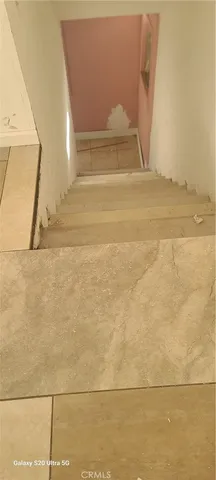 a bathroom with a shower and window