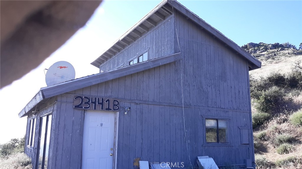 23441 El Rancho Drive Tehachapi, CA 93561 - Photo 3 of 30 a view of a wooden door