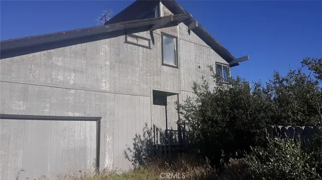 a house view with a backyard space