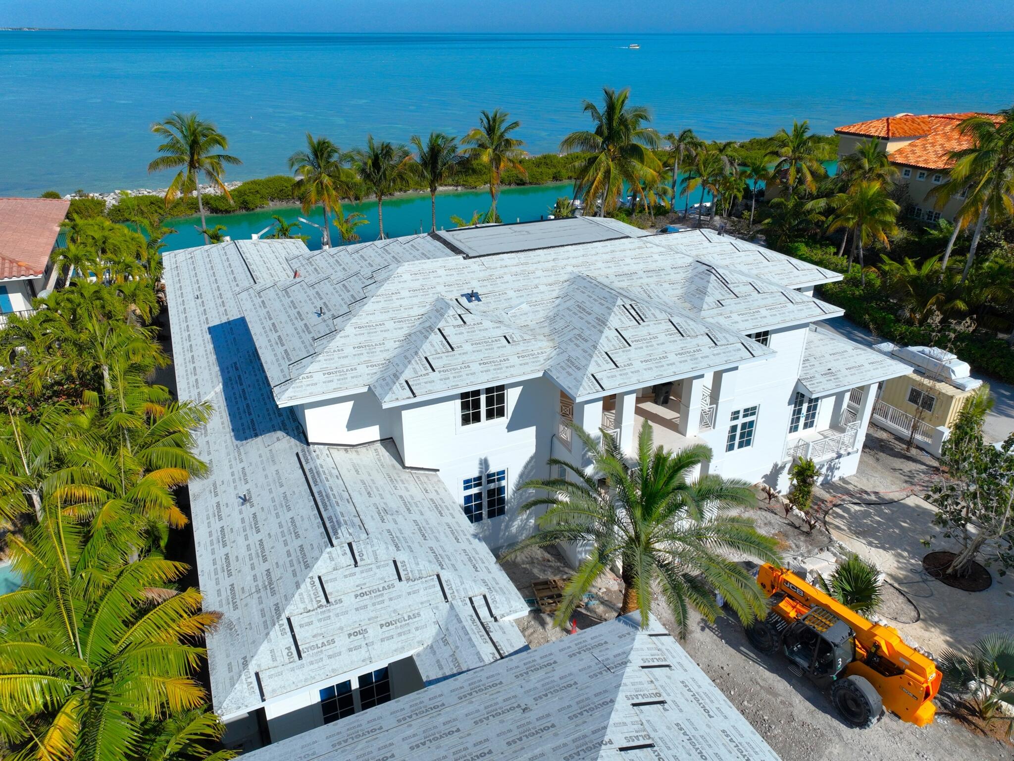 304 Melaleuca Street Marathon, FL 33050 - Photo 6 of 16 an aerial view of a house with a garden