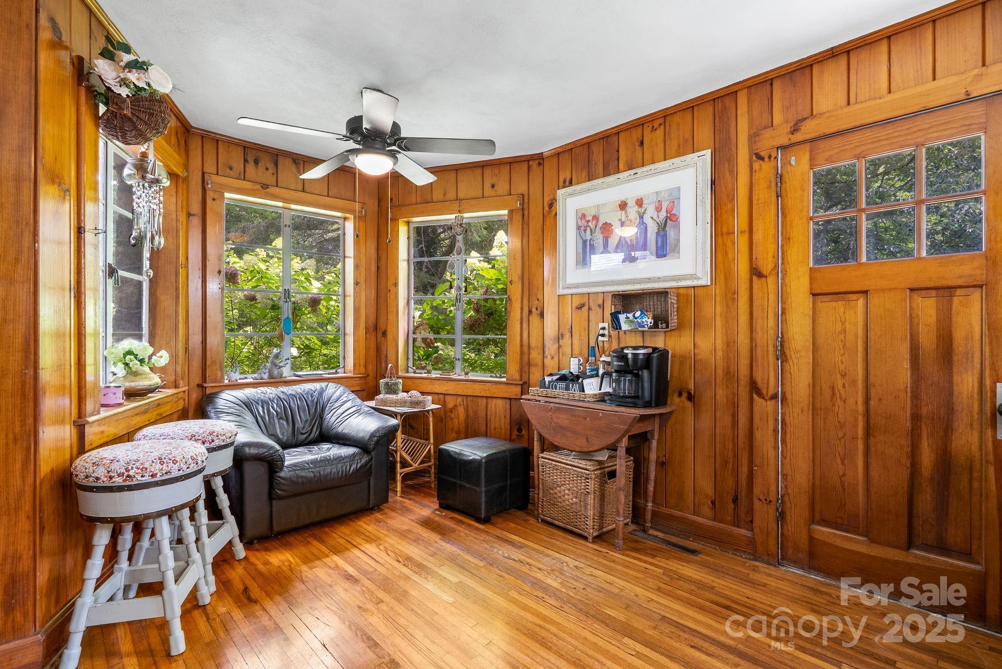 41 Hilton Drive Brevard, NC 28712 - Photo 15 of 32 a living room with furniture a window and a chandelier