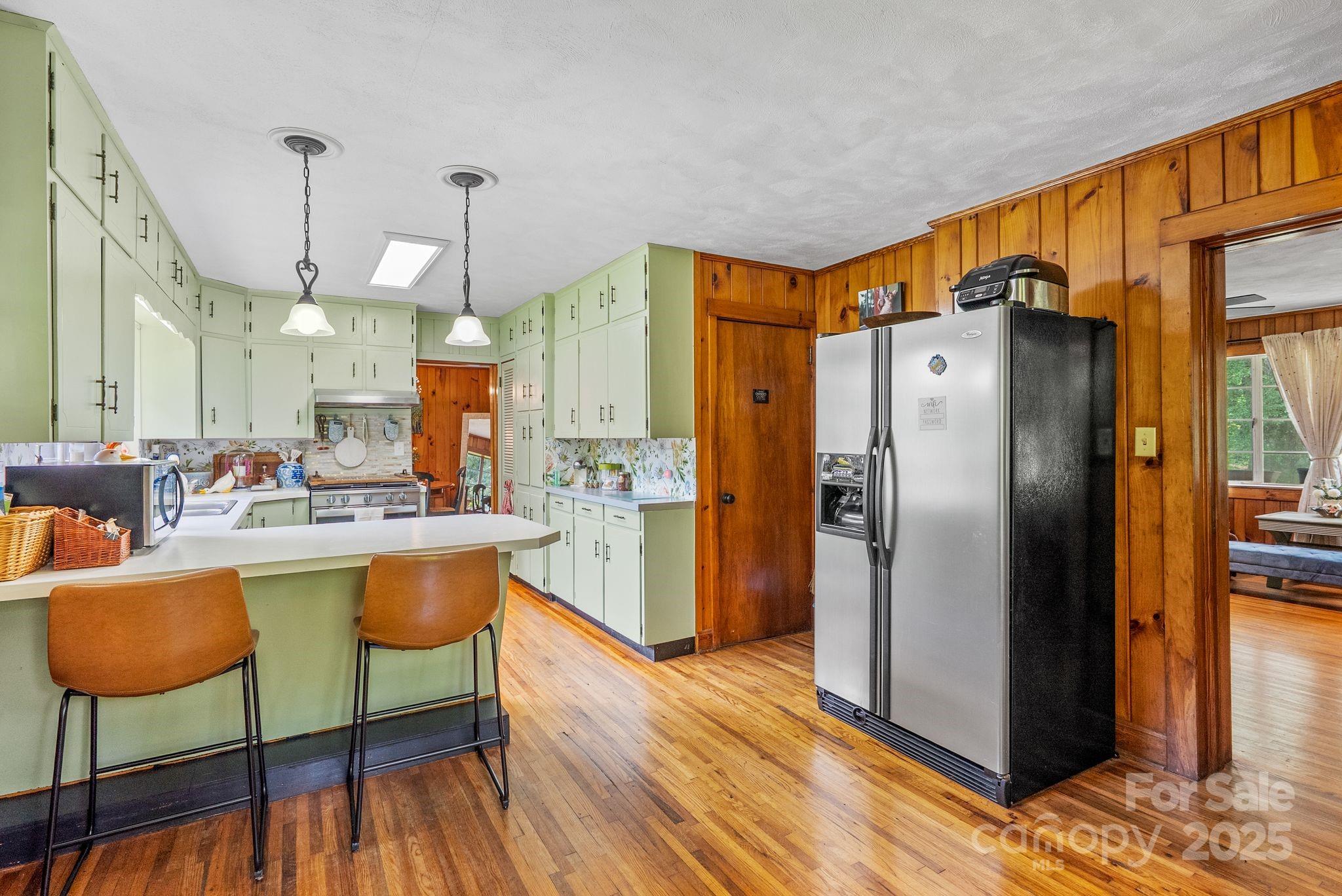 41 Hilton Drive Brevard, NC 28712 - Photo 17 of 32 a kitchen with stainless steel appliances granite countertop a refrigerator a oven and a sink
