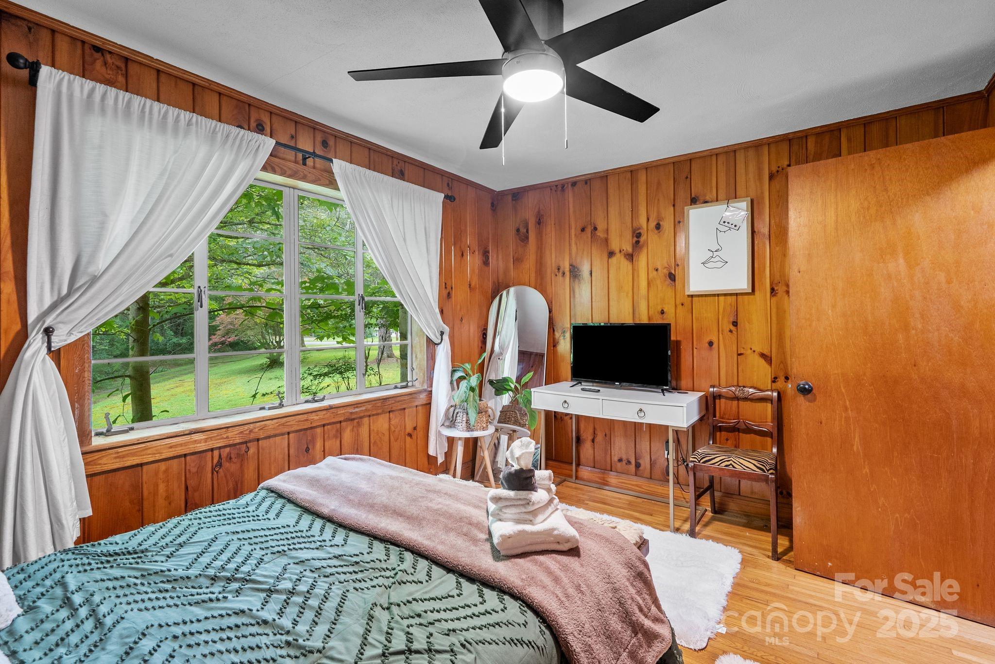 41 Hilton Drive Brevard, NC 28712 - Photo 28 of 32 a bedroom with a bed and a computer on the desk