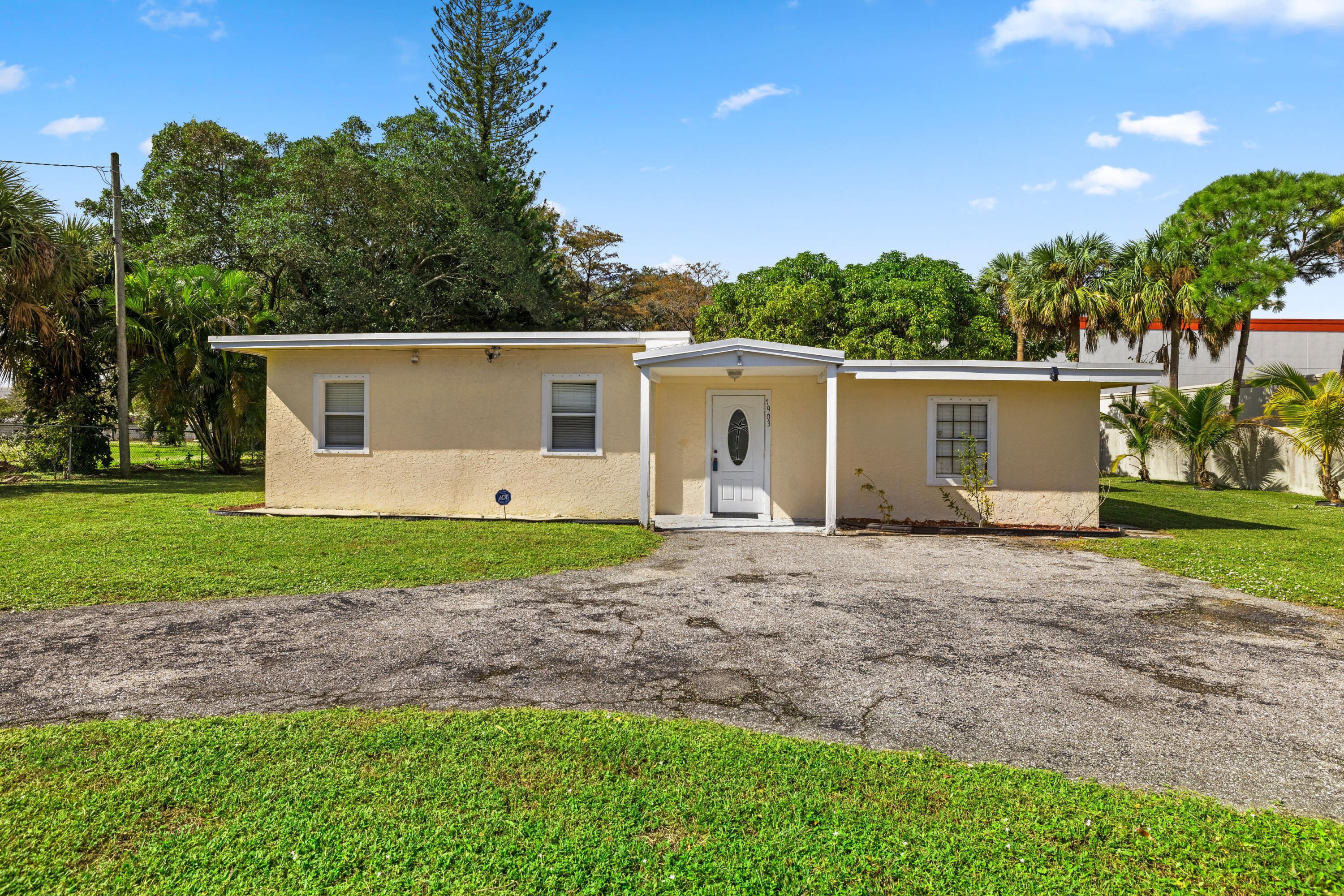 1903 Donnell Road West Palm Beach, FL 33409 - Photo 1 of 38 Front of Home