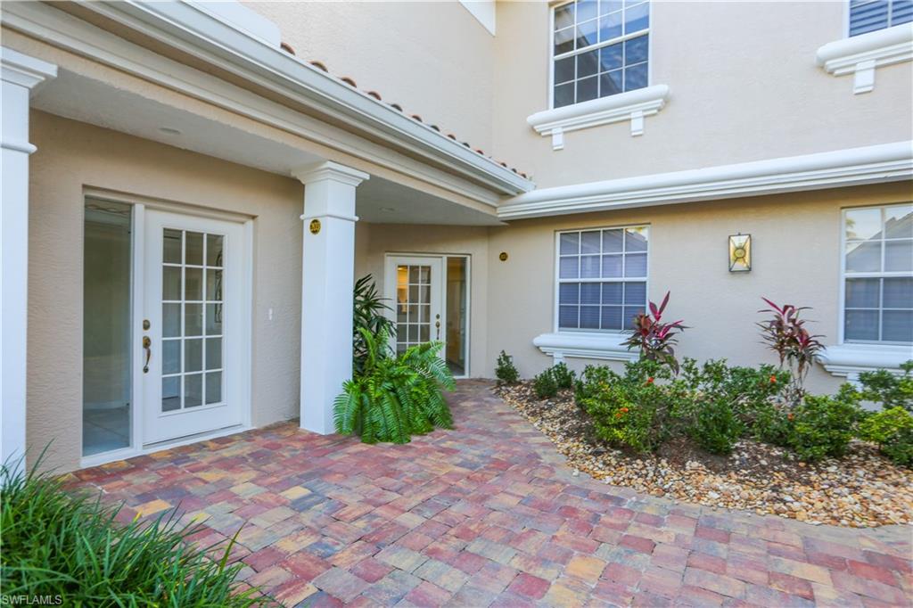 3930 Deer Crossing Court, Unit 3103 Naples, FL 34114 - Photo 11 of 50 a front view of a house