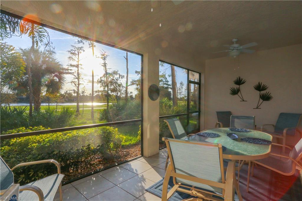 3930 Deer Crossing Court, Unit 3103 Naples, FL 34114 - Photo 12 of 50 a balcony with table and chairs
