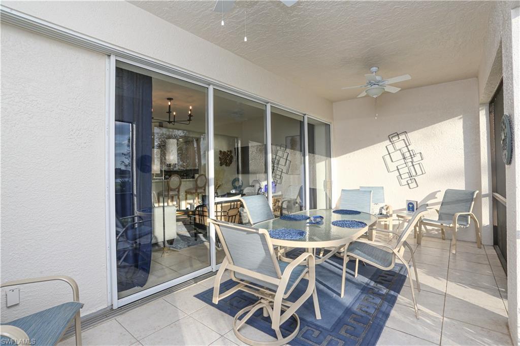 3930 Deer Crossing Court, Unit 3103 Naples, FL 34114 - Photo 14 of 50 a dining room with furniture and window