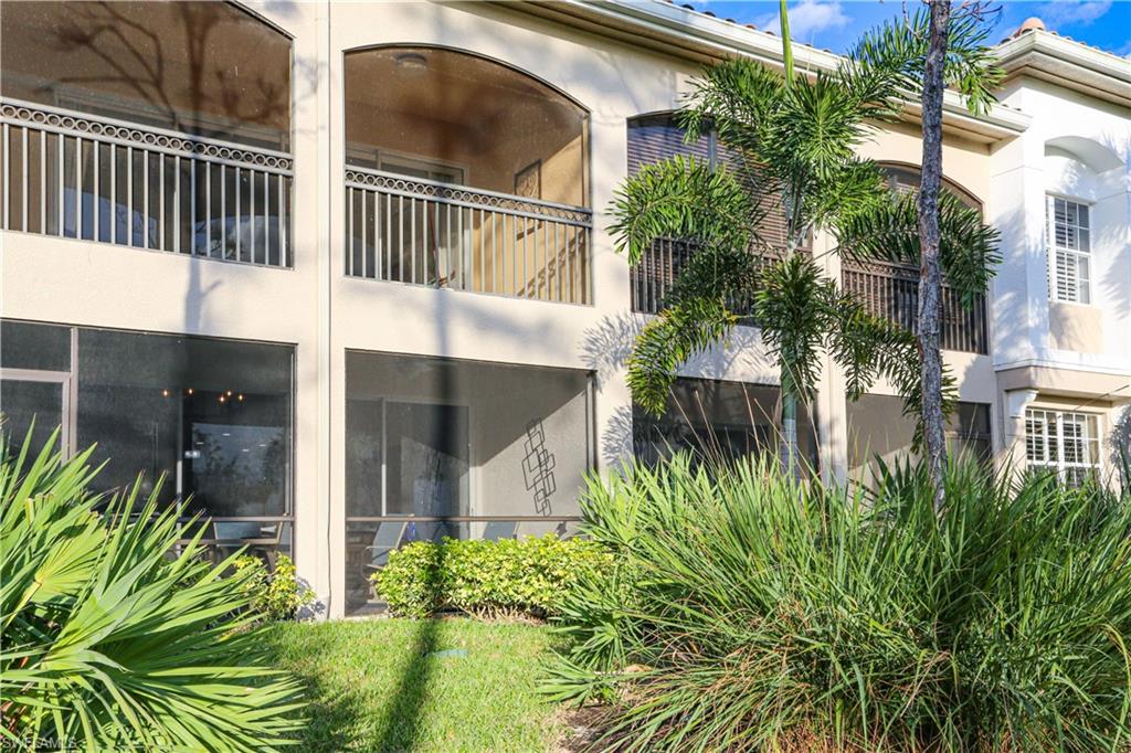 3930 Deer Crossing Court, Unit 3103 Naples, FL 34114 - Photo 17 of 50 a view of a house with a yard