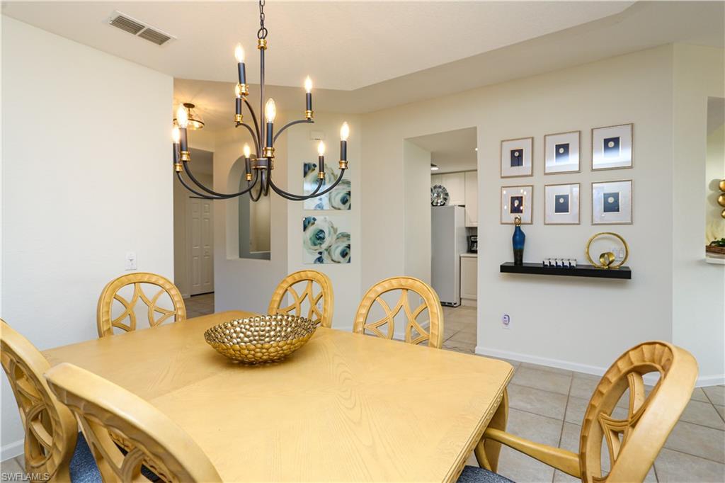 3930 Deer Crossing Court, Unit 3103 Naples, FL 34114 - Photo 34 of 50 a view of a dining room with furniture