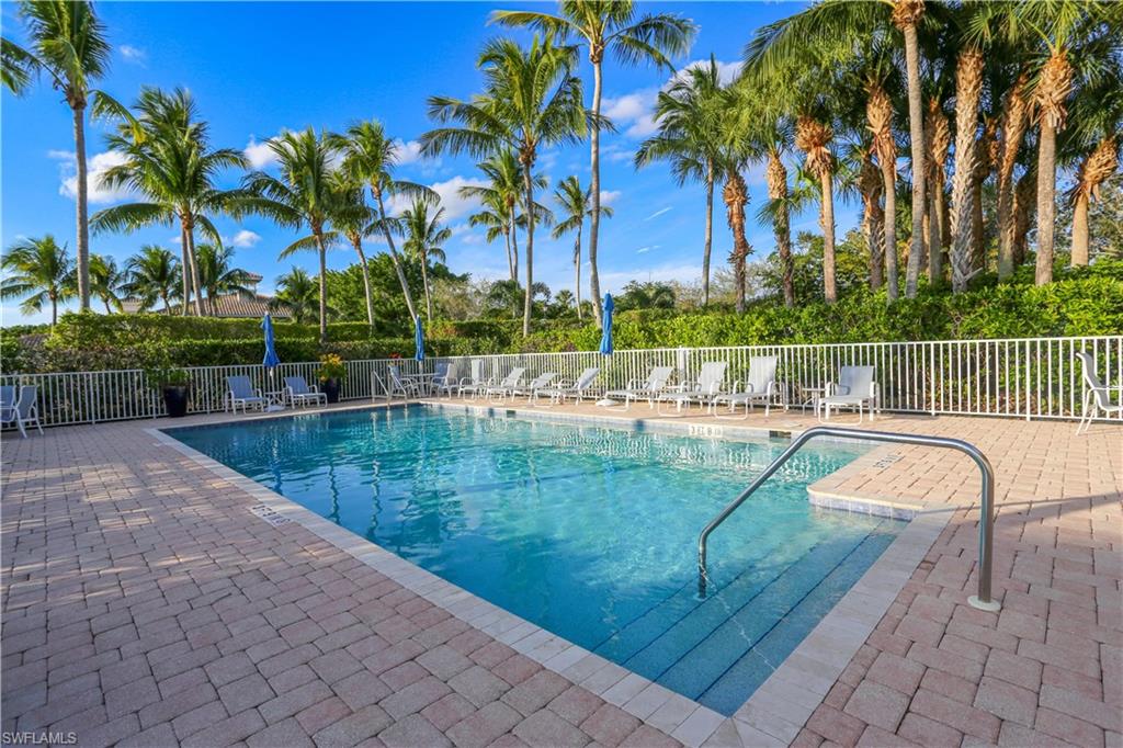 3930 Deer Crossing Court, Unit 3103 Naples, FL 34114 - Photo 5 of 50 a view of a swimming pool with a patio