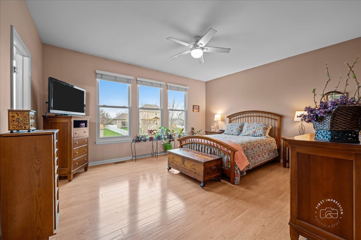2519 Imgrund Road North Aurora, IL 60542 - Photo 15 of 33 a bedroom with a bed and a flat screen tv